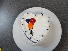 Heart-shaped ice cream cake decorated for Mother's Day