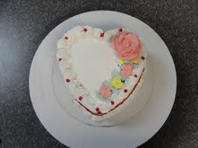 Heart-shaped ice cream cake decorated for Mother's Day